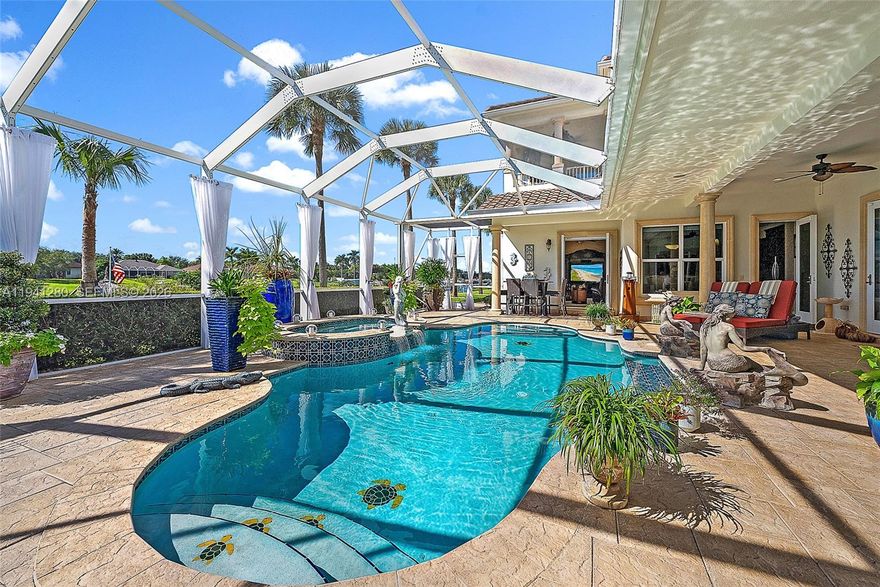 $240,000 price reduction—this is the one you don't wait on. Over 150 feet of waterfrontage, a private dock with lift, and a backyard that lives like a private resort—pool, spa, summer kitchen, fire pit, and tiki hut made for sunset nights. From your dock, enjoy a scenic boat ride to the waterfront restaurants in Stuart. Inside, this custom-built estate offers soaring ceilings, travertine floors, multiple living spaces, a first-floor guest suite, office, elevator, and a chef's kitchen built for entertaining. Impeccably maintained by its current owner, this home shows true pride of ownership throughout. Located in a gated community with low HOA fees and easy access to everything. Priced to move—and it will. Don't miss it!