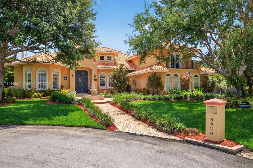 Pristine and luxurious this 6BR/5BA canal-front custom home on private cul-de-sac will impress the most discerning Buyer. Beautiful entry w/ water fountain, huge french doors, marble floors, & formal living w/ fireplace. Enjoy newer chef’s kitchen w/top-tier appliances & oversized island looking out to gorgeous pool. Retire to your master suite with spa bath, digital shower, jacuzzi, and large dual California closets. Huge upstairs flex suite, resurfaced resort style pool, Kohler generator, & lush landscaping. This home is great for entertaining with long driveway & huge turnaround w/ 3 car garage. Over 9 fruit trees and vegetable planters have been planted carefully on over 1/2 acre. Built in 2008 you will appreciate lower costs on insurance.  Meticulously maintained and move-in ready.