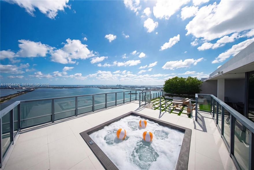 Panoramic Views at One Paraiso! A rare opportunity to own this almost new, hardly lived in, waterfront 2-story Upper Penthouse, where breathtaking ocean, bay, city & skyline sunset views unfold from every room. Spanning over 3,137 Sq.Ft., this 4BD/5.5BA N.E. corner two-story residence is wrapped in floor-to-ceiling glass, filling the interiors with natural light. A private elevator foyer entry, an open eat-in kitchen with an island, multiple balconies, & a gorgeous primary suite with walk-in closets, primary bath with dual sinks, & separate tub & shower. High ceilings everywhere, complete electric shades throughout, a storage room, and 2 parking spots. Entertain in Style! What sets this home apart is the expansive private covered rooftop terrace with a summer kitchen, jacuzzi, and an incredibly rare offering in Miami. This pet-friendly building is known for its resort-style lifestyle & full-service experience. Residents enjoy world-class amenities including multiple waterfront pools, tennis courts, a State-of-the-Art fitness center, spa & sauna, movie theater, Amara restaurant, business center, valet, concierge, & 24-hour security, all within one of Edgewater’s most prestigious towers. Perfectly positioned in Edgewater, you’re surrounded by the Design District, Midtown, Wynwood, & Downtown Miami, top dining, shopping, & cultural destinations just mins away. Enjoy waterfront park & dog park, baywalk paths, & easy access to Miami Beach & MIA Airport. Subject to court approval