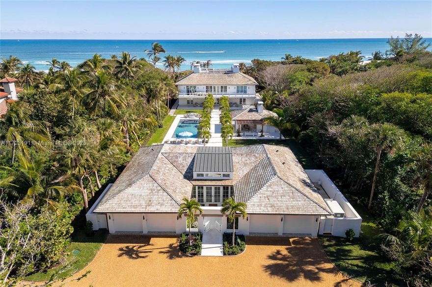 Experience coastal luxury in this all-new construction masterpiece that's like owning your own 5-star resort. Nestled on 2+/- acres with 150 feet of direct ocean frontage, complete with a private beach equipped with power and water. Be the first to own this legacy property, designed for lasting durability and timeless elegance. The property offers 7 ensuites, 11 bathrooms, breathtaking ocean views, sweeping balconies, and a west-side garden. Built with limestone, cypress, oak, and copper, blending modern technology with enduring quality. Guesthouse includes a fitness room and kitchenette. A spectacular palm alleé creates a pool pavilion paradise that includes a fireplace, lush landscaping, and a motor court with a 4-car garage. A rare opportunity for unparalleled luxury on Jupiter Island.