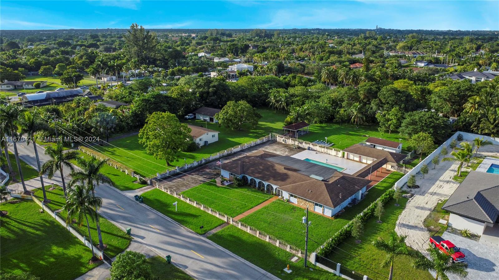 Prime Development or Remodel Opportunity in prestigious Horse Country. This rare offering boasts over an acre of land (46,173 SF) surrounded by multimillion-dollar estates, perfect for building your dream home or investment project. You can purchase one or both side-by-side properties as a package deal, offering immense potential. The existing home features 5 bedrooms and 4 bathrooms, including two master suites, and the charming cottage was beautifully remodeled in 2013. A new roof was added in 2018. The expansive grounds provide ample space for parking boats, RVs, and up to 10 vehicles, with room for further improvements. Whether you choose to remodel or build new, this property offers unmatched flexibility and value in a highly sought-after area. Don’t miss this unique opportunity!