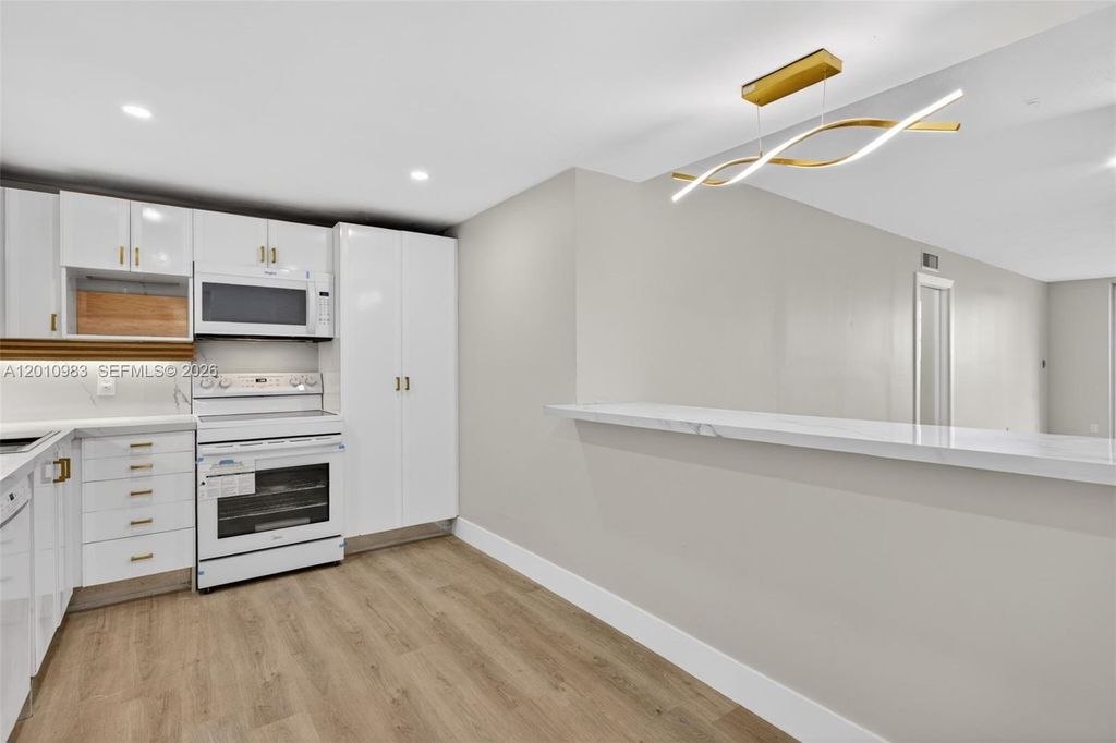 Photo of 3090 N Course Dr #807, Pompano Beach, FL 33069 (MLS # A12010983)
