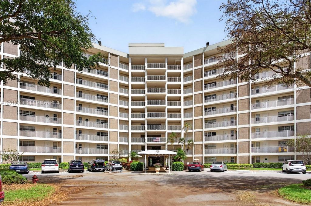 Photo of 3090 N Course Dr #807, Pompano Beach, FL 33069 (MLS # A12010983)