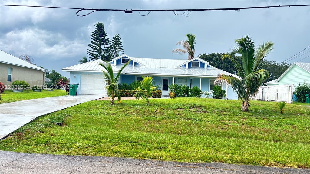 Photo of 445 SW Cherryhill Rd, Port St Lucie, FL 34953 (MLS # A12081334)