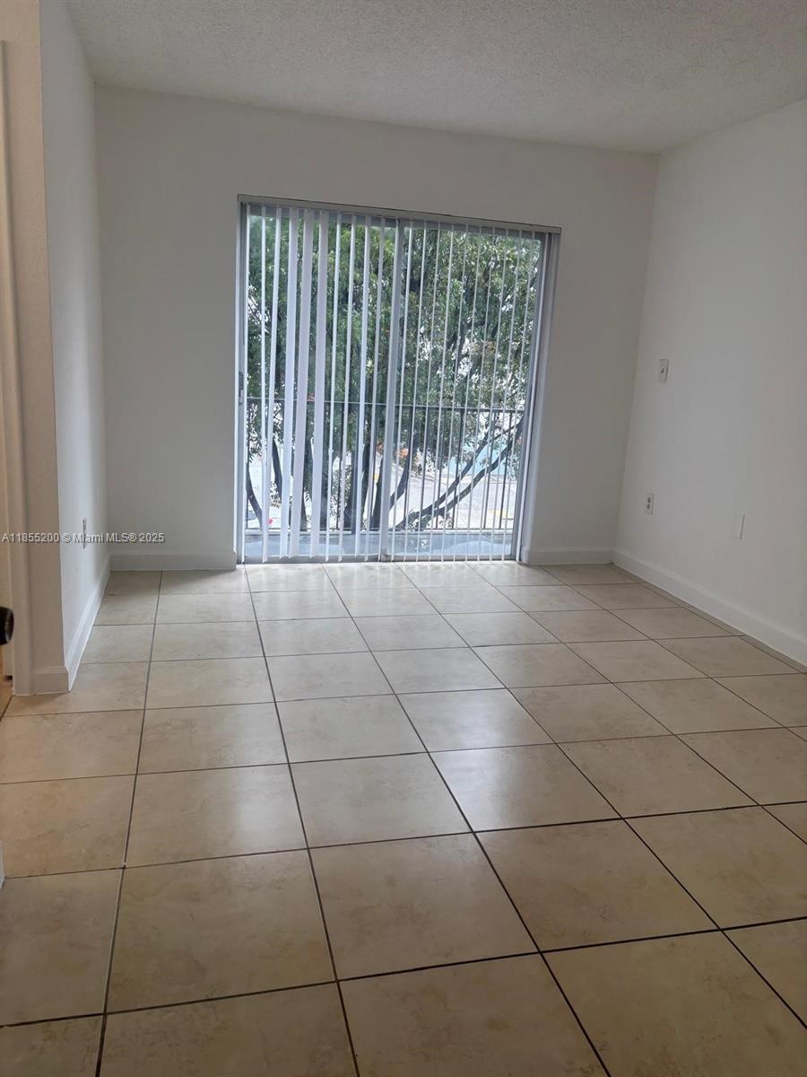Spacious 2-bedroom unit featuring tile floors throughout and a private balcony. Both bedrooms offer ample space and abundant closet storage. Convenient on-site laundry facilities. Ideally located within walking distance to Westland Mall and just minutes from the Palmetto Expressway, restaurants, supermarkets, and more.
