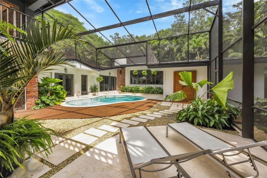 Are you ready to fall in love with this spectacular 4,600 sf 5/4 bilevel masterpiece on a 23,783 private tropical sf lot? This exquisite home has been totally REMODELED w/ no expense spared. Features include an expansive private master suite w/ its own terrace + balcony, master bath + walk-in closet, chef’s kitchen w/ custom cabinetry, 4 custom bathrooms, porcelain tile floors throughout & a courtyard pool with outdoor shower. Located in the tropical enclave of Devonwood, this true oasis is a masterpiece with the most gorgeous pool & deck, NEW impact glass windows & doors, updated electric & plumbing, NEW AC units & NEW roof. Additional features include multiple living areas, separate guest suite & 2 family rooms, perfect for entertaining. Agents bring your buyers who demand only the BEST.