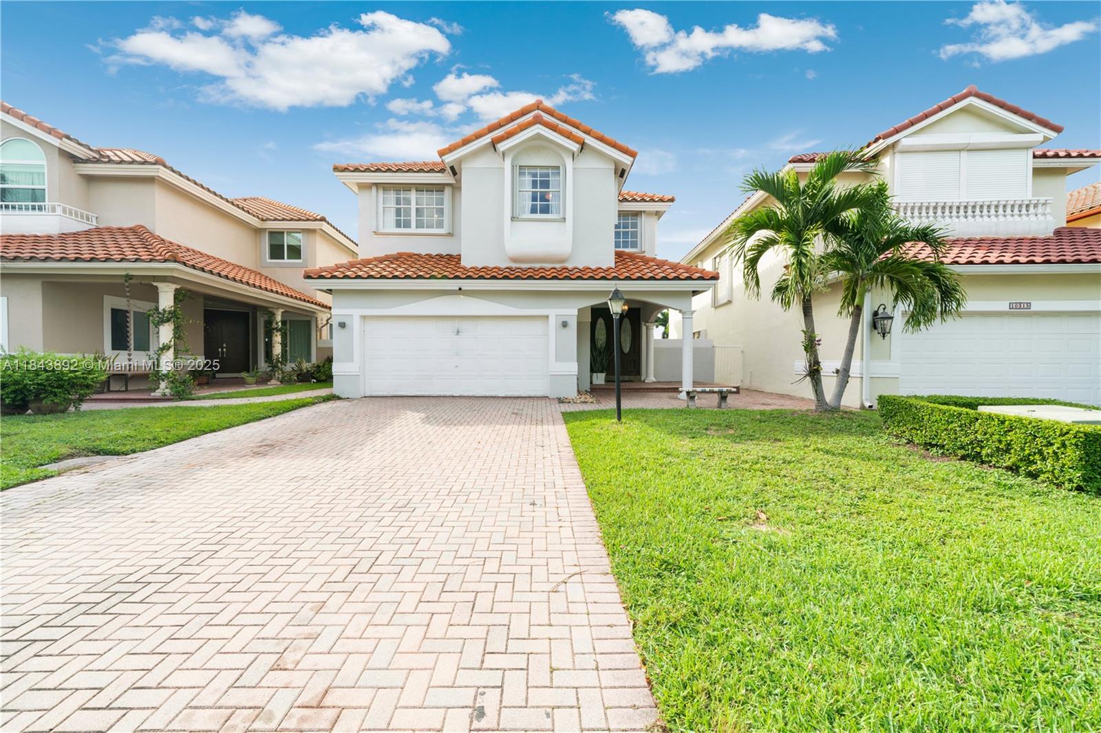 Golf and lake view gem in gated Doral Palms Estates! Enjoy sunsets over Trump Silver Golf Course from this 2-story home with 4 beds, 2.5 baths, and double-height ceilings. Remodeled with open kitchen, modern baths, porcelain floors, Bosh appliances, gas range & water heater, and custom master closet. Kitchen features sintered stone countertops and a cozy breakfast nook overlooking the golf course. Primary suite offers floating bath and golf view. 2-car covered garage + 4 uncovered in front. Laundry next to garage. Includes Doral Park Country Club membership: pool, gym, tennis, pickleball, golf, playground, bar & restaurant. Backyard has renderings ready to build a pool. Near top Doral schools, Turnpike, Palmetto, Dolphin & International Mall. 24/7 security. A true gem!