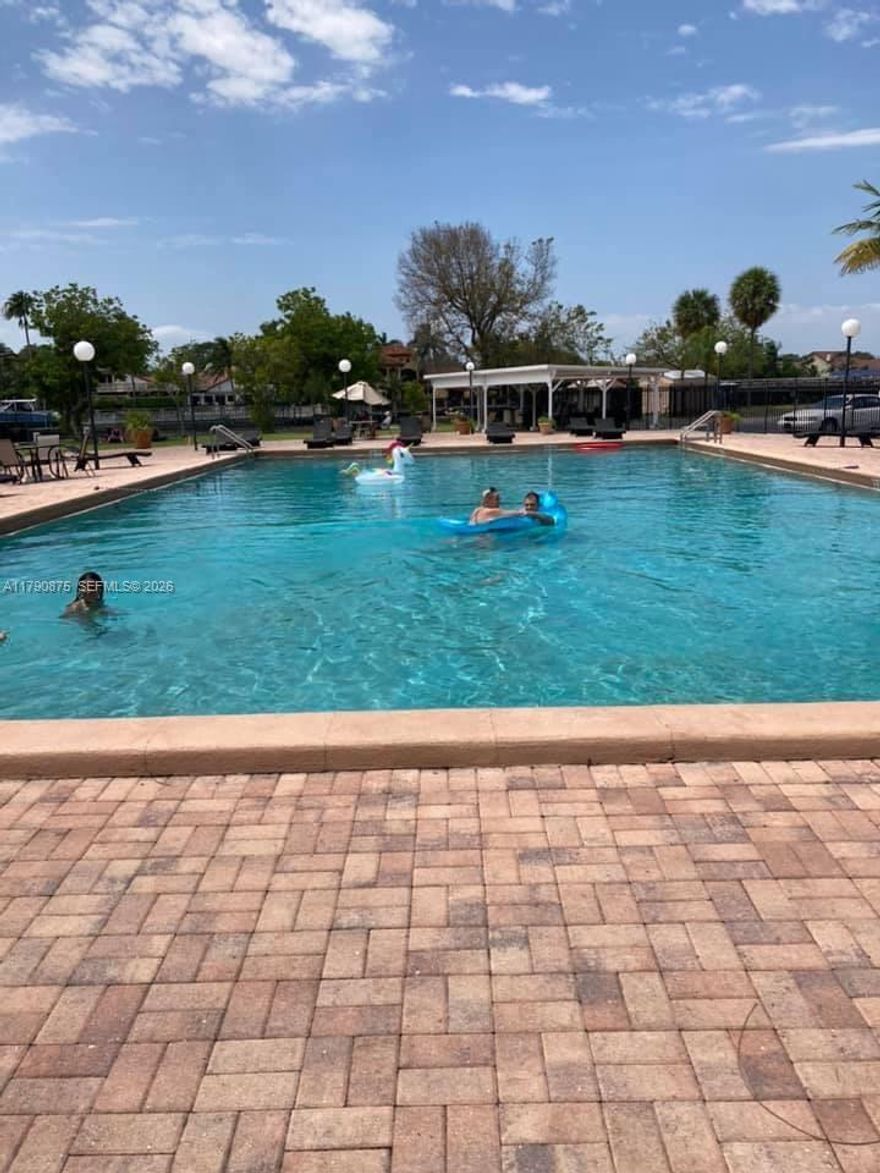 Hallandale Beach condominium across from beautiful John Scavo park with playground. 2 BR corner unit with den and 1.5 bathrooms. Freshly painted, porcelain flooring and carpeting in bedrooms. Spacious closets with exterior storage space on the floor where laundry facilities are located. Low maintenance. Amenities include heated pool, sauna and tennis court. Near Walmart, Publix and all shopping, banks, and restaurants.  Great for a couple with a child. Priced to sell as is.