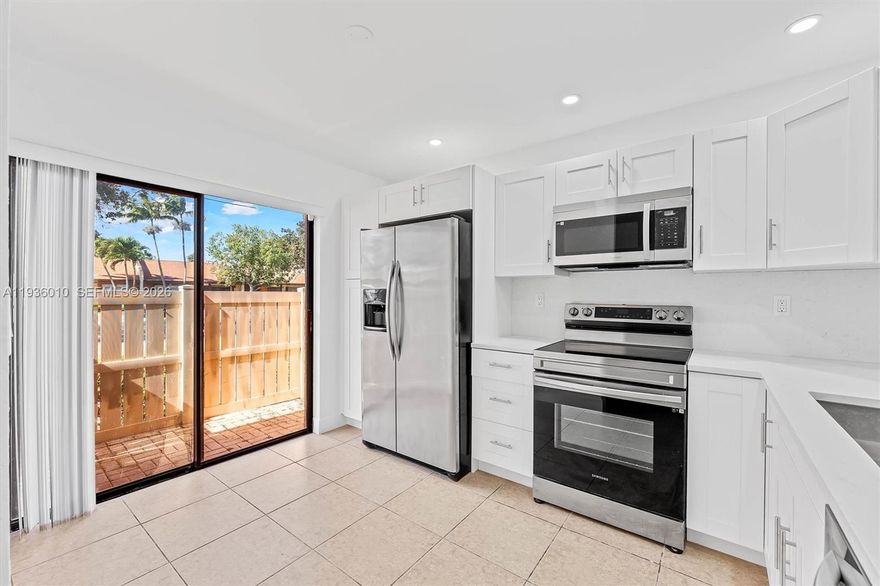 Move-in ready 2BR/2BA villa in desirable Woodlake Isles. Updated home features new roof, new water heater, and an open-concept kitchen with full quartz backsplash. Tile floors throughout, fresh paint, new baseboards, bright living/dining area, walk-in closet, and first-floor entry. Private fenced patio for outdoor enjoyment. Community offers heated pool, tennis courts, and clubhouse. HOA covers exterior maintenance, roof, landscaping, insurance, and pool. Pet-friendly with approval. Centrally located near shopping, dining, and major roads. Vacant and easy to show.