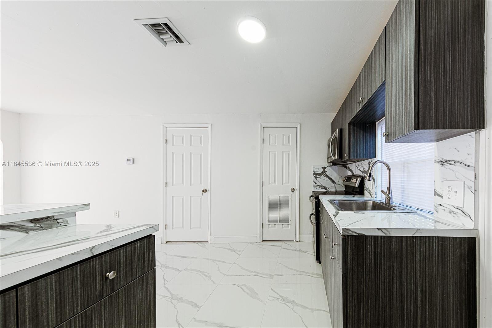 Discover the perfect blend of comfort and convenience in this fully renovated gem! Every detail has been thoughtfully addressed, from the peace of mind offered by a brand new roof to the heart of the home – a spectacular new kitchen designed for both everyday living and entertaining. Gleaming new floors and a fresh coat of paint create a bright and welcoming atmosphere. Its unbeatable central location puts you mere minutes from the pristine sands of the beach, a diverse selection of restaurants, and endless entertainment options. Live the ultimate Florida lifestyle!