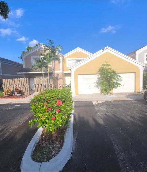 Photo of 1393 NW 124th Ave #1393, Pembroke Pines, FL 33026 (MLS # A12089365)