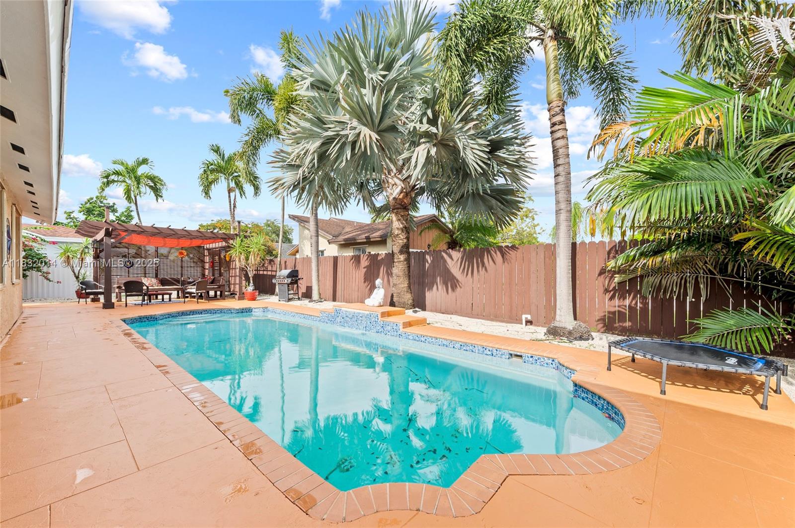 Charming 3BR/2BA single-story POOL home with 2-car garage located on a quiet street in desirable Palmetto Bay. Features soaring cathedral ceilings, a real wood kitchen with granite countertops, stainless steel appliances, and a bright breakfast area. The spacious living area flows into a tropical backyard oasis with a large heated pool, custom pergola with built-in seating, and a BBQ area—perfect for entertaining. Enjoy peace of mind with Zone X (no flood insurance required), storm shutters, and a removable pool fence. Located near top-rated schools: Howard Drive Elementary, Palmetto Middle, and Palmetto High. Conveniently close to parks, shopping, dining, and top hospitals. This well-maintained home offers the ideal South Florida lifestyle in one of Miami’s most sought-after communities.
