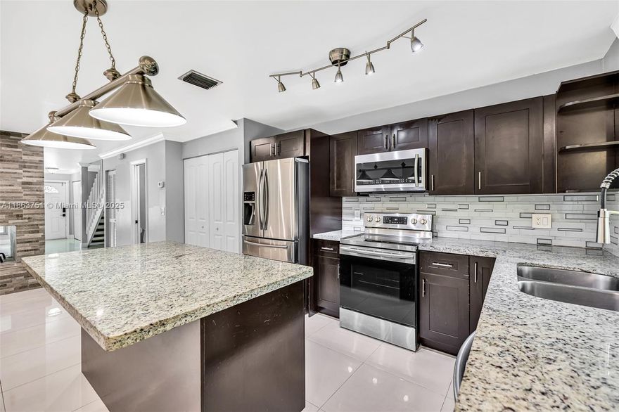 Fully renovated Corner unit townhouse in the heart of Coral Springs. Newer kitchen and bathrooms. Impact grade windows and doors. Working Fire Place. All bedrooms located on the 2nd floor.Two assigned Parking spots. HOA covers Exterior, Roof, Water, Lawn care and Trash Removal. This townhouse is also listed for rent for $3000 monthly