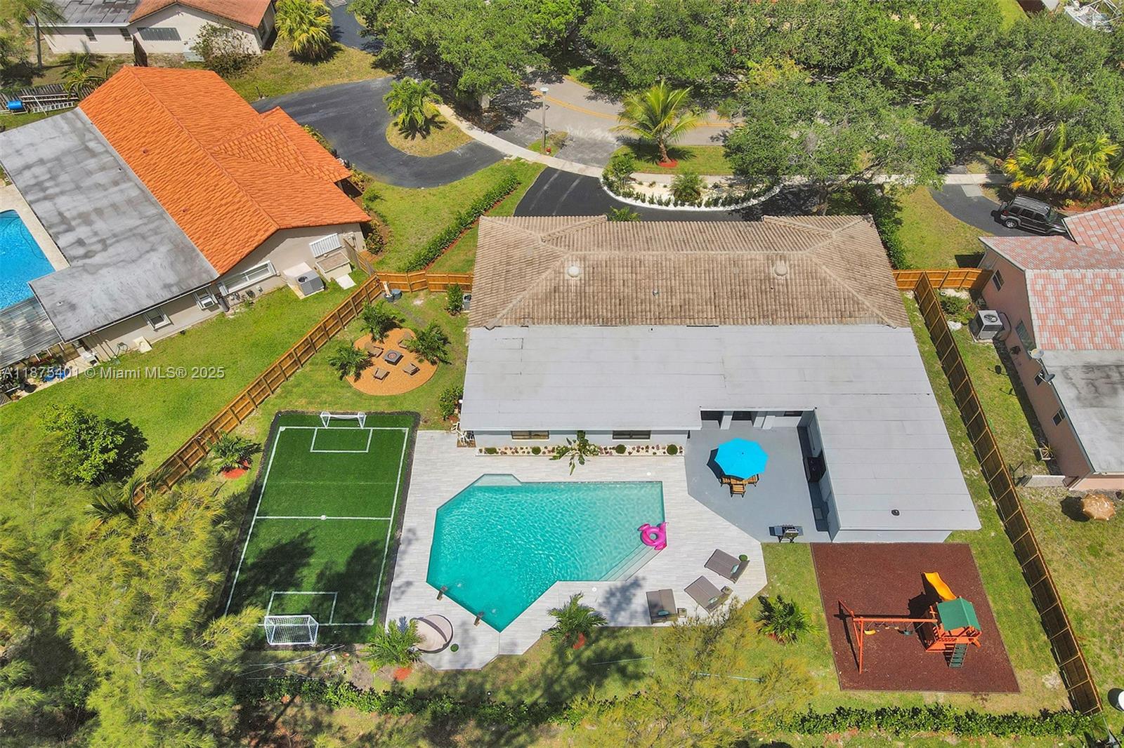 Discover an extraordinary home nestled on a sprawling lot - this meticulously renovated 7-bedroom, 4-bathroom home is a masterpiece of modern living. The interior boasts stunning, contemporary finishes with spacious rooms that flow seamlessly, creating an inviting and elegant atmosphere perfect for family life and entertaining. Step outside to an incredible backyard oasis featuring a sparkling swimming pool, a cozy fire pit for memorable evening gatherings, and a dedicated soccer playground. The large outdoor space is thoughtfully designed to provide both relaxation and recreation, making this property a dream come true for families seeking comfort, style, and functionality.