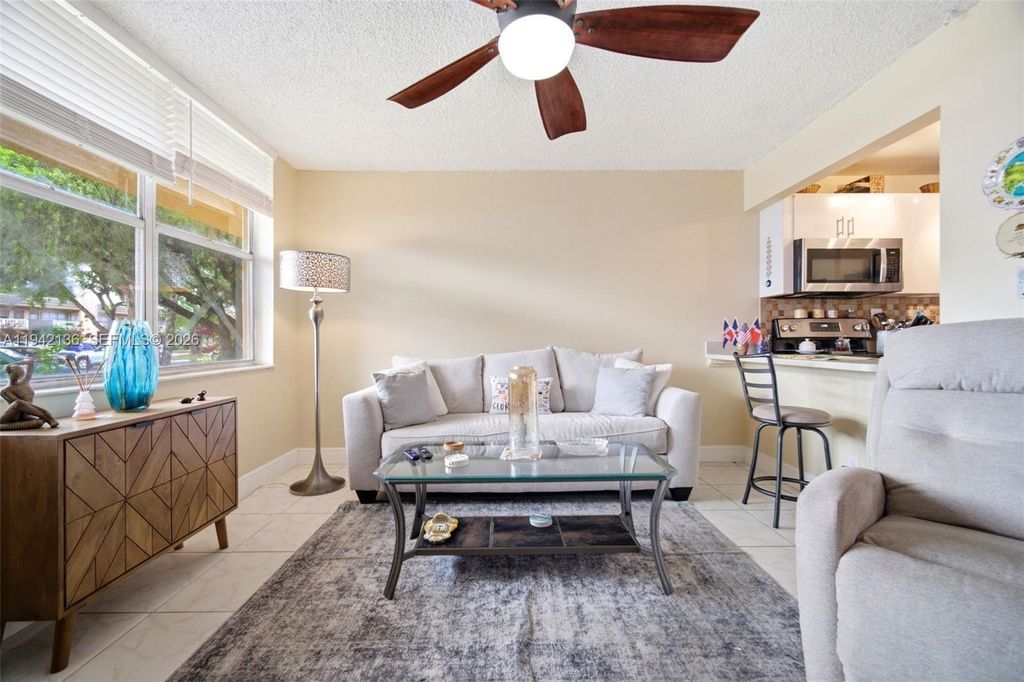 Photo of 9121 Sunrise Lakes Blvd #114, Sunrise, FL 33322 (MLS # A11942136)