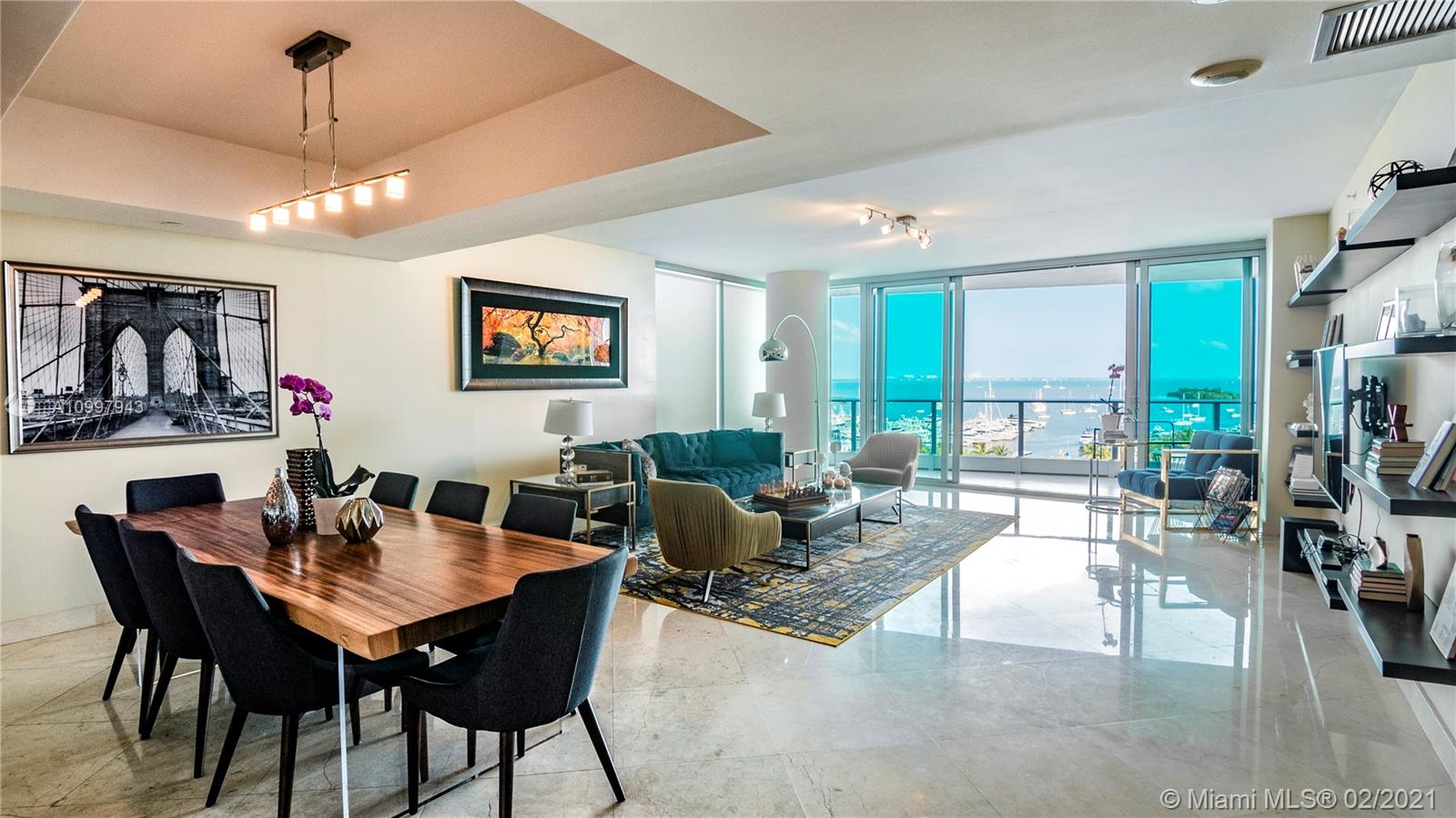 A rarely available corner flow through unit at the Grovenor Coconut Grove. One of the best buildings in Miami, beautiful nautical theme through out the building with resort style amenities, including tennis court, basket ball court, spa, gym, several entertainment areas ect. The Views are of the marina and the bay, great floorplan and spacious rooms. A truly desirable lifestyle in the heart of the grove.