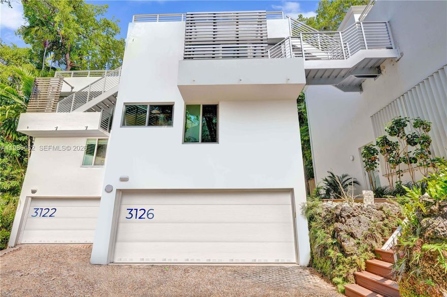 Quietly tucked away in the heart of Coconut Grove, this 2-bedroom / 2.5-bathroom multi-level townhouse offers privacy, natural light, and modern improvements. Floor-to-ceiling impact windows and doors (2021) fill the home with sunlight, highlighting the open-concept kitchen, dining, and living areas—ideal for everyday living and entertaining. The second level features a versatile loft plus an additional space perfect for a home office or den. Recent improvements include (2024) roof and rooftop stairway (booth association replaced and maintained), as well as (2024) solar panel system with battery storage capable of powering the home for days, providing low FPL bills, and a tankless water heater. That, plus a cement structure, provides security and safety during intense Florida weather. Enjoy multiple outdoor living areas, including a large rooftop terrace nestled among mature trees and a fenced backyard patio. Complete with a 2-car garage and located just moments from Coconut Grove’s marinas, parks, shopping, dining, and entertainment, this home combines comfort, efficiency, and an unbeatable location. Generous pet policy, up to 3 pets! Rapid association approval 1+/- week, with interview.