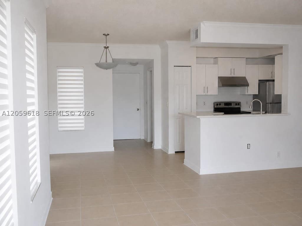 Photo of 2452 Centergate Dr #104, Miramar, FL 33025 (MLS # A12059618)