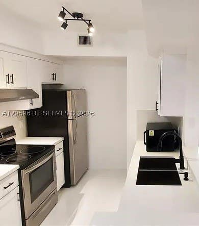 Photo of 2452 Centergate Dr #104, Miramar, FL 33025 (MLS # A12059618)