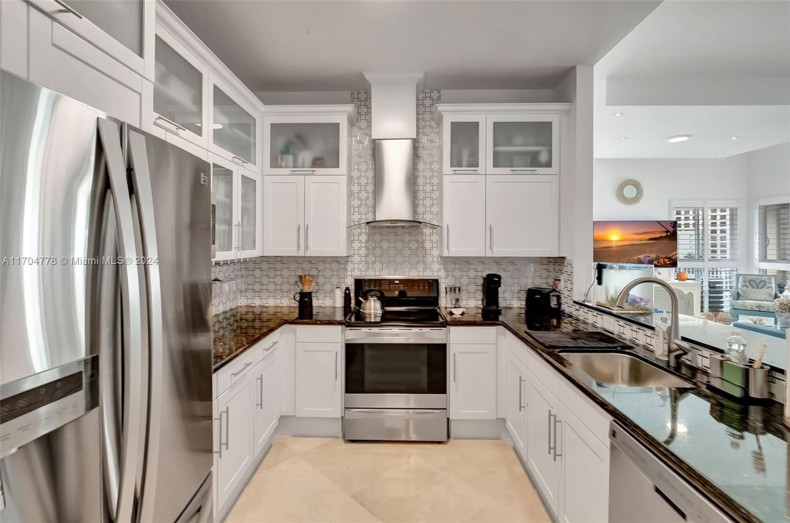 6 month or 1 year furnished or unfurnished rental available for spacious urban penthouse, corner unit w/12' high ceilings & foyer entrance. Only 2 units on top floor. 2 principal bedrooms + open dining room. Light & bright with 24" cream, marble floors, plantation shutters, modern lighting & bath fixtures. In unit washer/dryer combo. Open, white, eat-in kitchen w/stainless steel appliances, wall mount canopy hood & marble backsplash. Large walk-in closets w/custom cabinetry, 290 sq ft terrace w/sunset views. Assigned, parking in garage. Urban lifestyle affords many restaurant choices downstairs. Across from Dadeland Mall w/180 stores, including Gucci. Metrorail, Publix & Trader Joe's, just 2 blocks away. (Not all furniture pictured is included). For unfurnished option speak to Agent/Owner.