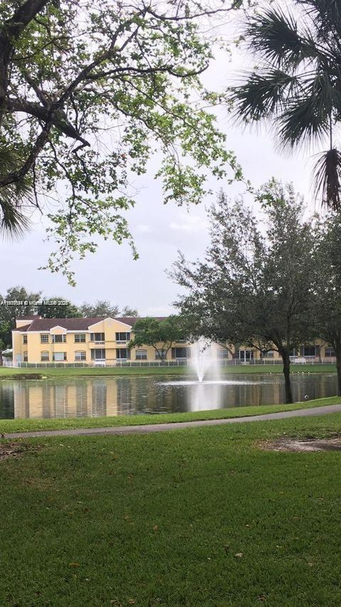 Photo of 8592 W Sunrise Blvd #111, Plantation, FL 33322 (MLS # A11919144)