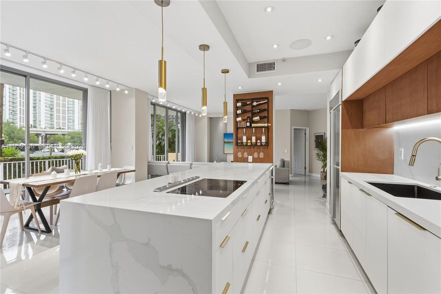 Rare first-floor corner residence with direct marina and open water views, offering exceptional privacy and a unique layout with no shared walls. This fully remodeled unit delivers seamless indoor-outdoor living and a highly desirable floor plan rarely available. Enjoy a private patio overlooking the marina, perfect for entertaining or relaxing by the water. The residence features built-in ceiling speakers in the master bathroom and kitchen, plus patio speakers, a drinking water filtration system, new A/C (2023), new water heater (2025), remote-controlled curtains, and blackout shades in all bedrooms. Two (2) storage units are included with a full-price offer. Furniture may be included with a full-price offer, excluding the baby’s crib. Turnkey waterfront corner unit with privacy, upgrades, and extra storage in one of Mystic Pointe’s most desirable locations.