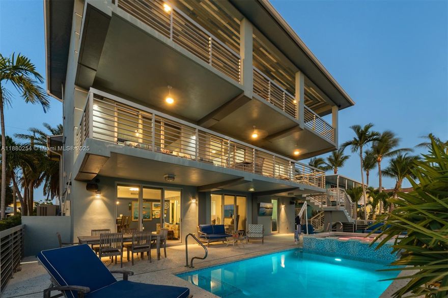 Recently appraised at $4.2M, the Sea Pearl is a rare coastal masterpiece just four parcels from the Gulf. Built in 2016, this ultra-modern smart home offers 5 bedrooms, 5.5 baths, and over 4,100 sq. ft. of furnished luxury. Boaters enjoy 70’ of dockage with lift, water, electric, and stunning sunset views over a protected preserve. Features include a Control4 system, generator, impact windows/doors, metal roof, and glass elevator. Nearly 1,500 sq. ft. of porches overlook a resort-style pool and spa. Inside: custom kitchen with quartz counters, Viking induction, GE Monogram appliances, wine cooler, and spacious living areas. The top floor primary suite offers sweeping water views, spa bath, and custom closet. Optional White Marlin Beach access.