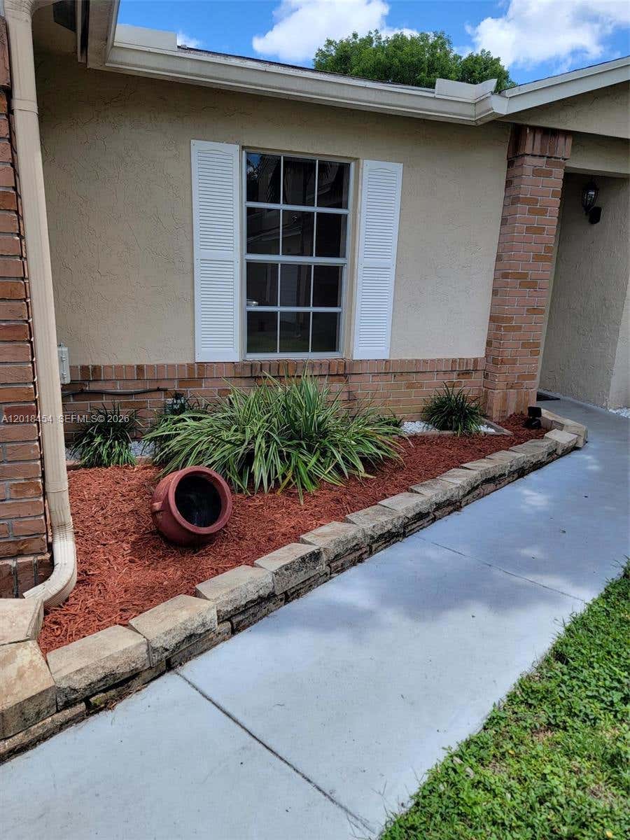 Photo of 14115 Langley Pl, Davie, FL 33325 (MLS # A12018454)