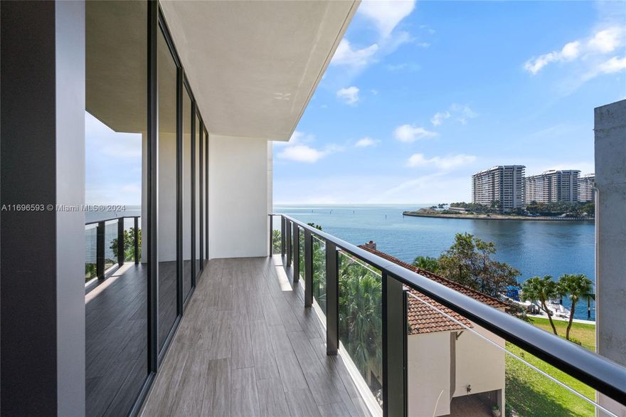 Largest residence in the building. Beautiful flow-through floorplan, huge master bedroom and closet. Unit has three assigned parking spaces & separate storage plus private elevator foyer. Boasting over 4100 sqft total with 4 bedrooms and 5.5 baths, this one-of-a-kind flow through floor plan offers everything imaginable for the ultimate boutique waterfront lifestyle. Interior details include 11ft ceilings, natural stone flooring, custom closets, built in bar area for flawless entertaining, and a chef inspired State of the Art kitchen! The building offers a stunning transition from the outdoors to the indoors. BOAT SLIP AVAILABLE.