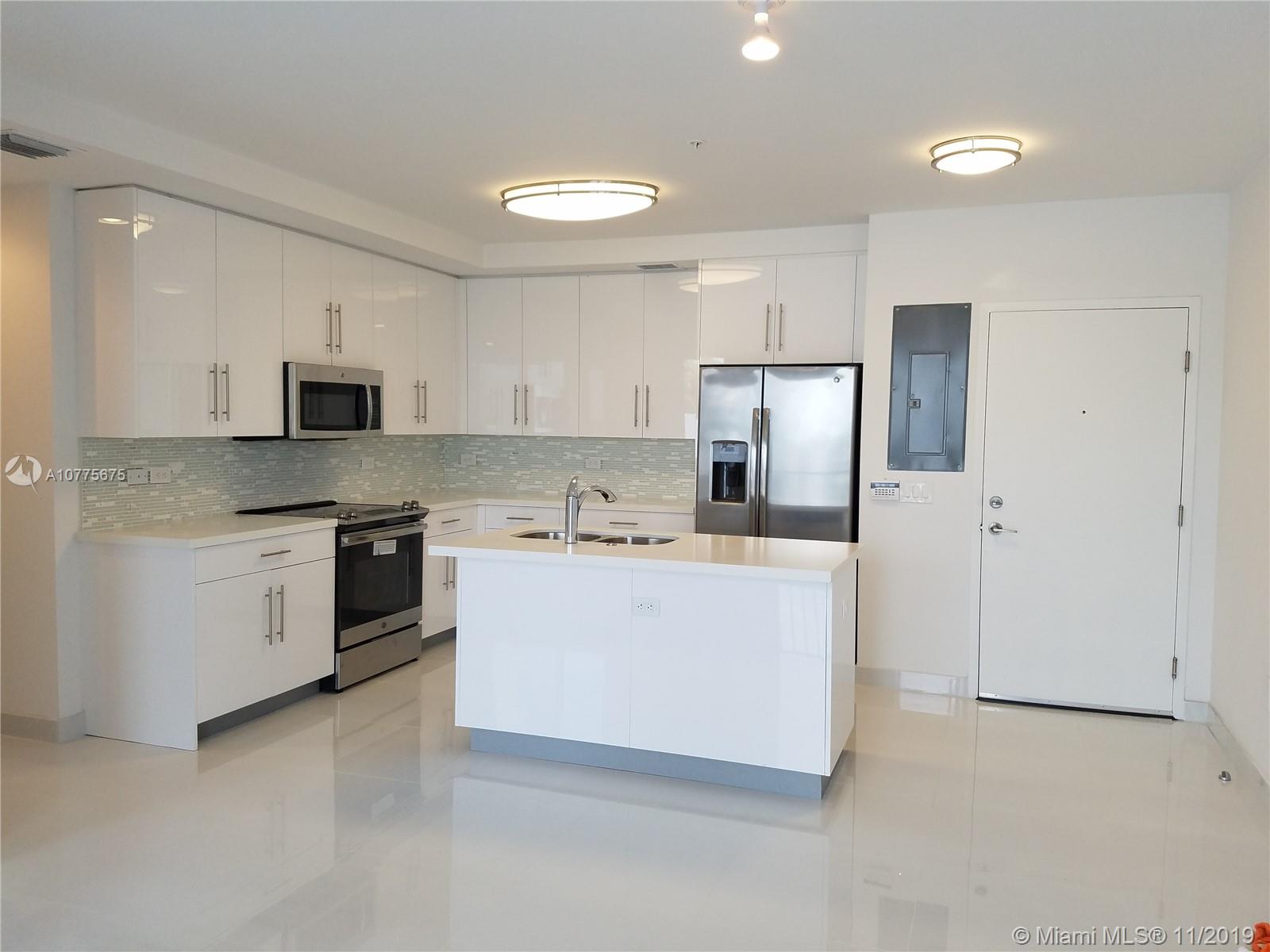Luxury Condo, 2 bed/2 bath plus Den, which has a window. 2 assigned parking spaces in open courtyard in the center of the complex. Luxury Italian kitchen with wood cabinetry, quartz counter tops, s.s. appliances, 24" porcelain white floors throughout. Lots of natural light with 2 balconies where you can relax and enjoy beautiful sunsets from and a community pool. Walk in closets. Stacked washer/ dryer included in the unit. High impact windows & doors. Walking distance from "Waterways", best public school in Aventura K-8 rated A school, House of Worship, close to Aventura Hospital and Aventura Mall, Gulfstream and US1. Also great location for commuting with the Brightline and Coastal Link, just a short distance away. Rent includes water, alarm and basic cable.