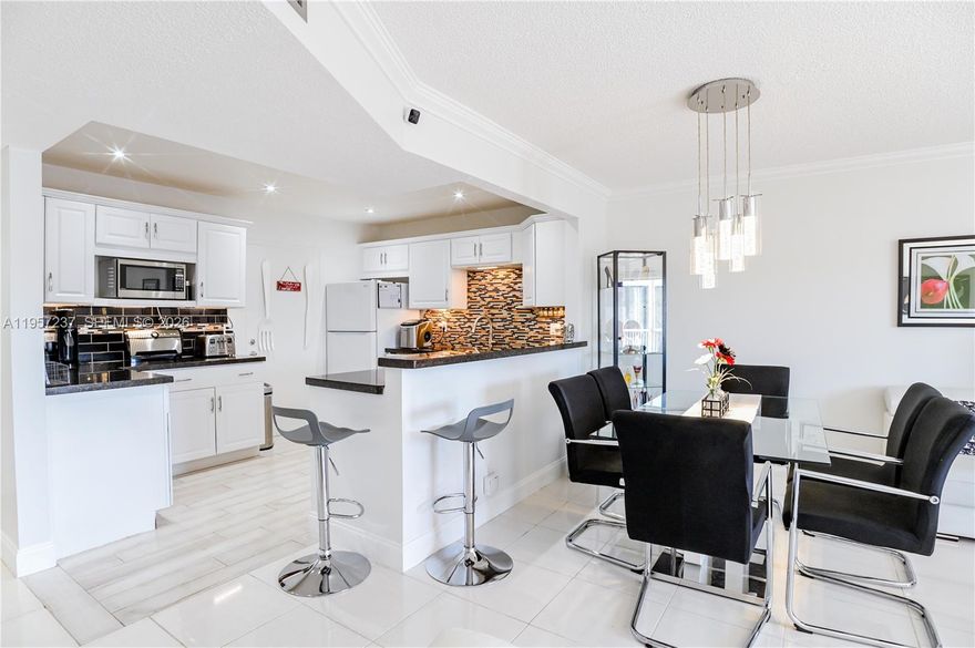 A MUST SEE!!! THIS BEAUTIFUL UPDATED FULLY FURNISHED (TURNKEY) 1 BED 1.5 BATH CONDO IN LAUDERHILL, CASTLE GARDENS (BUILDING 12). RELAX IN YOUR SCREENED-IN PATIO ENJOYING THE BEAUTIFUL FLORIDA WEATHER. ENJOY COOKING IN YOUR UPDATED OPEN-CONCEPT KITCHEN WITH GRANITE COUNTERTOPS. UPDATED BATHS. BEAUTIFUL TILE FLOORS THROUGHOUT. AMPLE STORAGE SPACE. JUST BRING YOUR TOOTHBRUSH! COMMUNITY BOASTS LOTS OF AMENITIES & ACTIVITIES, SWIMMING POOLS, BBQ PICNIC AREA, CLUBHOUSE, GYM, LIBRARY, BILLIARDS, SHUFFLEBOARD & SO MUCH MORE. MINUTES TO GOLF COURSE. CONVENIENTLY LOCATED NEAR EXPRESSWAYS, RESTAURANTS, SHOPPING, BEACHES, ETC. ALL CLOSE BY. TRULY A MUST SEE!