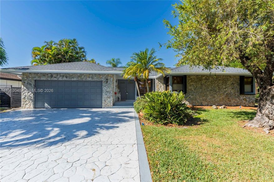 TRULY* UNIQUE * and rarely available in the market single home in Coral Springs Fl with 3 Bedrooms, 2 Baths seeking comfort and convenience. Perfect location situated on a spacious 14,483 square foot lot, it offers a tranquil and private environment.  Within walking distance of Costco, making daily shopping a breeze. Quick access to Sawgrass Expressway allowing easy connections to other areas of the city, close to a variety of restaurants, shopping mall and other retailers. The house has been fully updated, meaning you'll enjoy a modern and stylish home.  New Roof for peace of mind and durability.  Modern Baths equipped with high-quality finishes, contemporary kitchen and porcelain title flooring elegant and easy to maintain, adding brightness and sophisticated touch to the spaces.  Garage for 2 cars, ample space to securely store vehicles with long driveway capacity to park up to 4 additional cars.  This property is an excellent opportunity for anyone looking for a home in a prime location with modern amenities and an accessible environment.