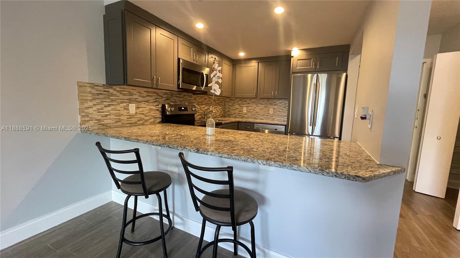 Beautiful First-floor unit in the Woodside Community, North Miami Beach. Features include a recently installed impact balcony door and windows, renovated bathroom with shower, open kitchen with stainless steel appliances, bedroom with huge closet, tile flooring throughout, and a screened balcony. One assigned parking space plus visitor parking. RENT INCLUDES: WATER/SEWER. Gated community with pool, conveniently located near Oleta River State Park, and the City Tennis Center. Enjoy nearby parks with tennis courts and bike paths, including Greynolds Park. Easy access to I-826, shopping, dining, and minutes from Aventura Mall and Sunny Isles Beach.