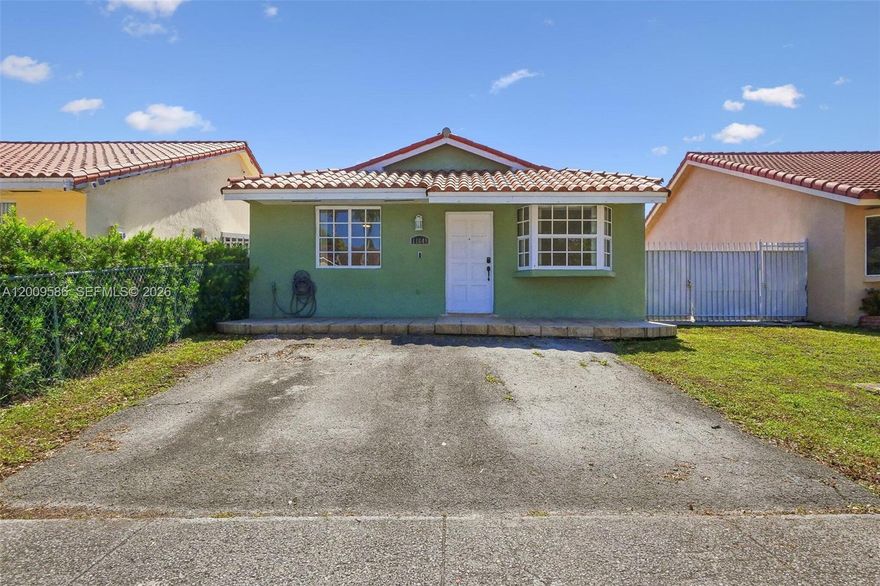 Move-in ready 3-bedroom, 2-bath home in Hialeah Gardens with no HOA. This well-maintained single-story property features 1,144 sqft of living space with tile flooring throughout. The kitchen includes granite countertops and a full appliance package. Both bathrooms have been updated with newer vanities and fixtures. Major upgrades include a brand-new central A/C system and water heater. The property includes a private fenced backyard, providing added space and privacy. The home is clean, vacant, and ready for immediate occupancy. Located in an established neighborhood, this property presents a strong opportunity to own a well-maintained home with recent updates and no HOA restrictions. Some photos have been virtually rendered.