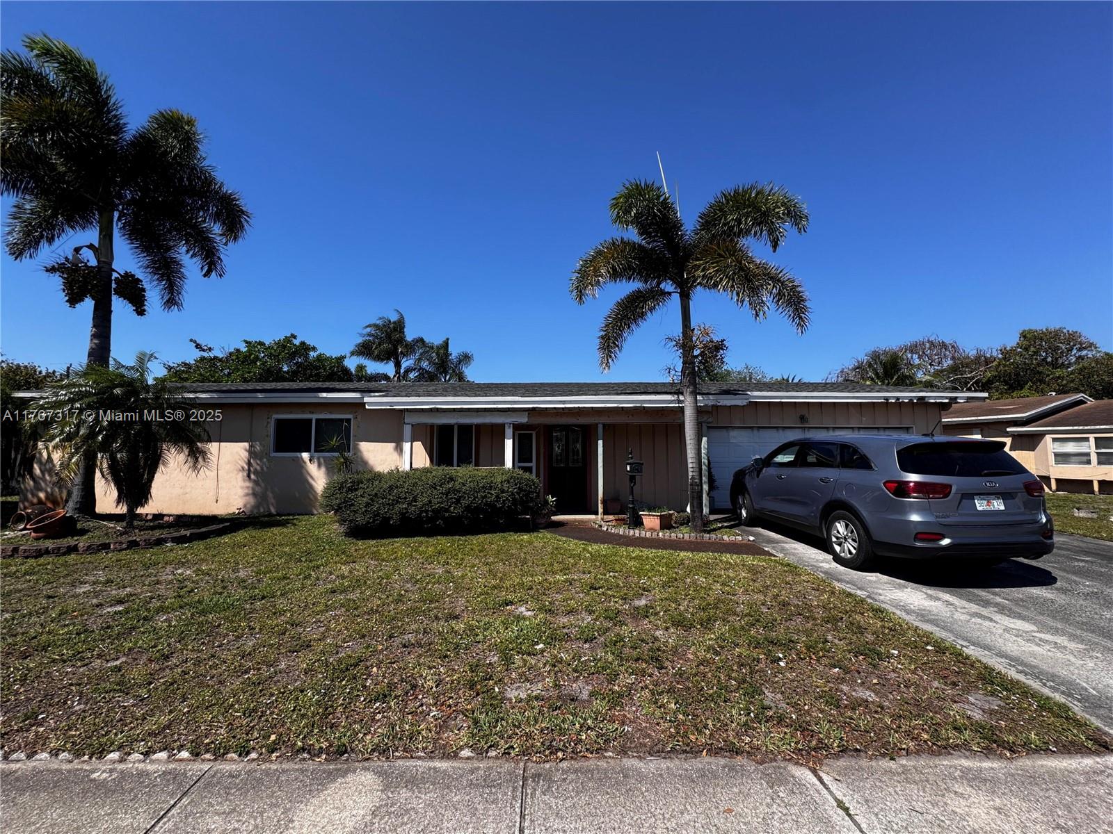 This 3-bedroom, 2-bathroom property is ready to be modernized! With over 2,000 sq ft under AC, it features a garage, a new roof, a new HVAC system, and impact windows throughout. Situated in a prime South Florida location, this is a great investment opportunity with tons of potential.