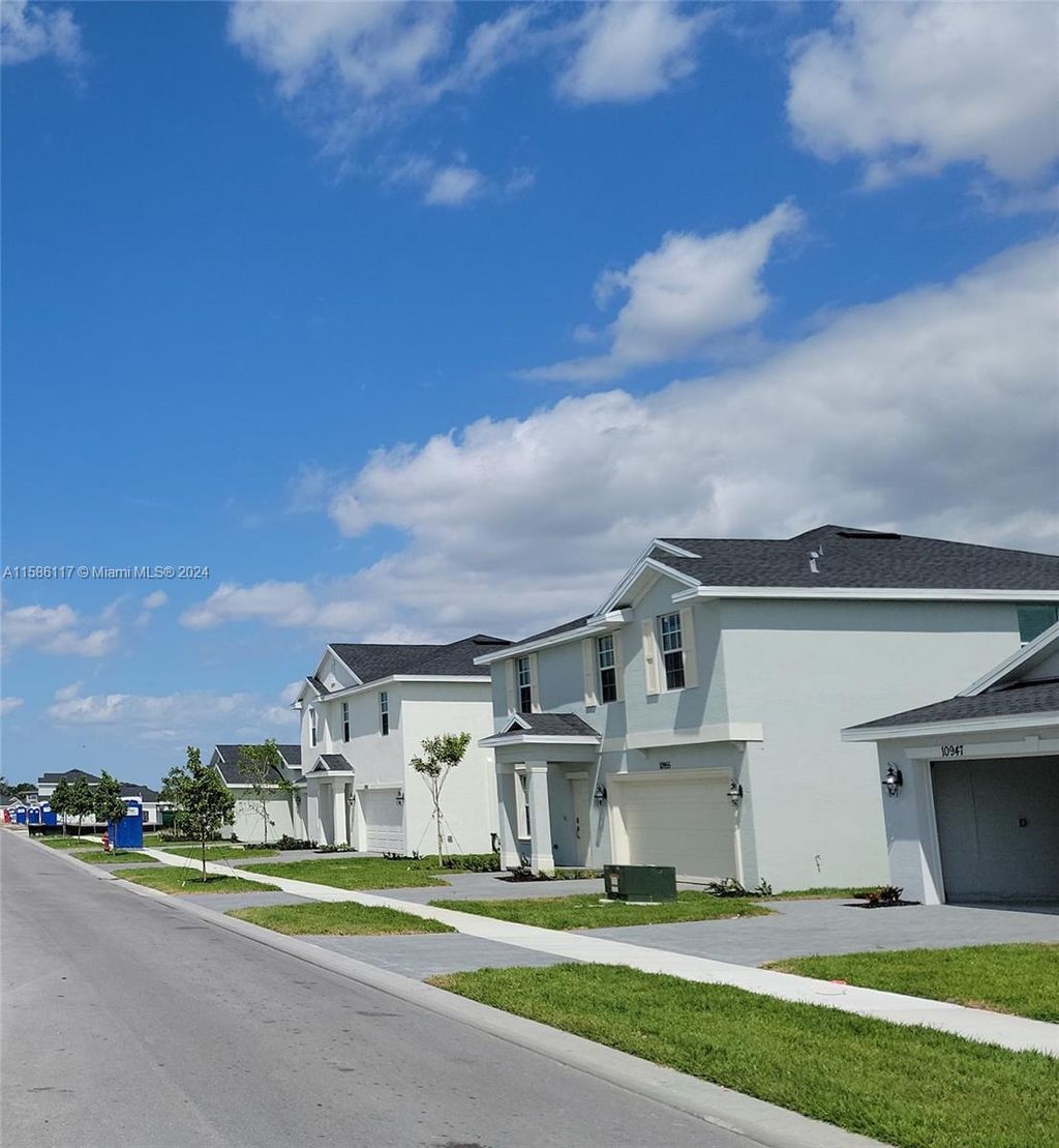 Photo of 10940 NW MIDDLE STREAM Dr, Port Saint Lucie, FL 34987 (MLS # A11586117)
