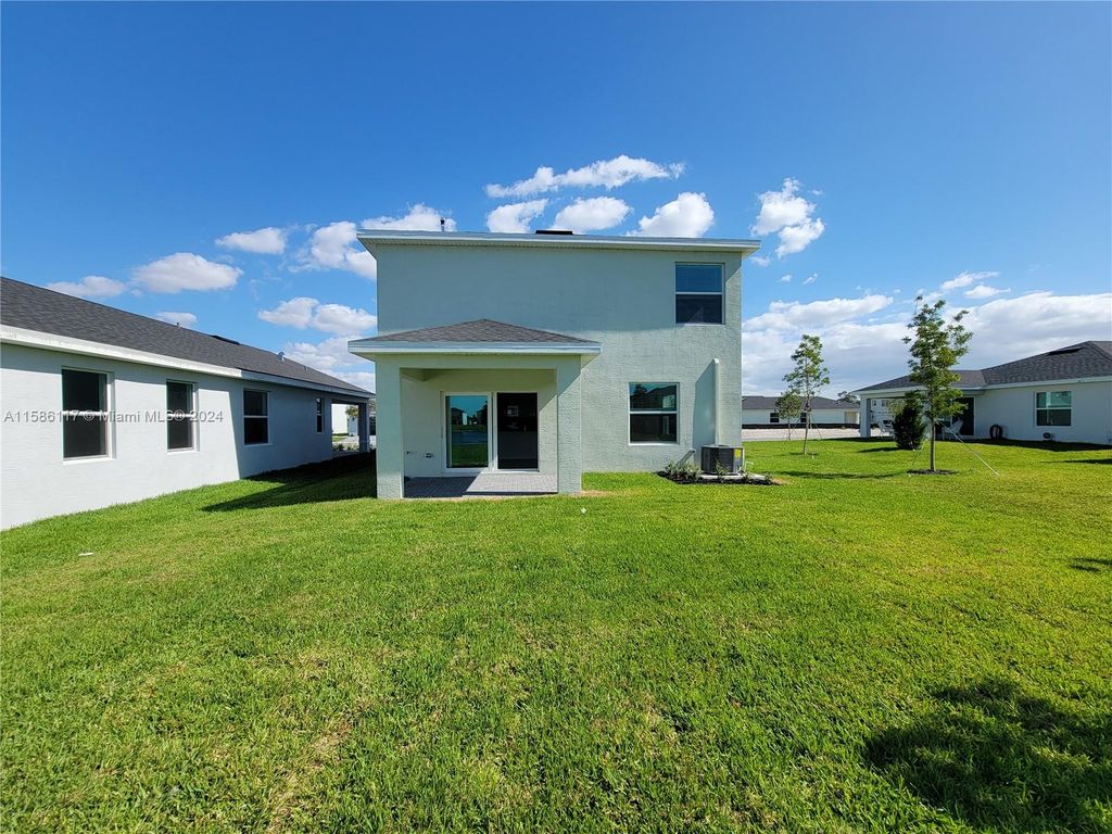 Photo of 10940 NW MIDDLE STREAM Dr, Port Saint Lucie, FL 34987 (MLS # A11586117)