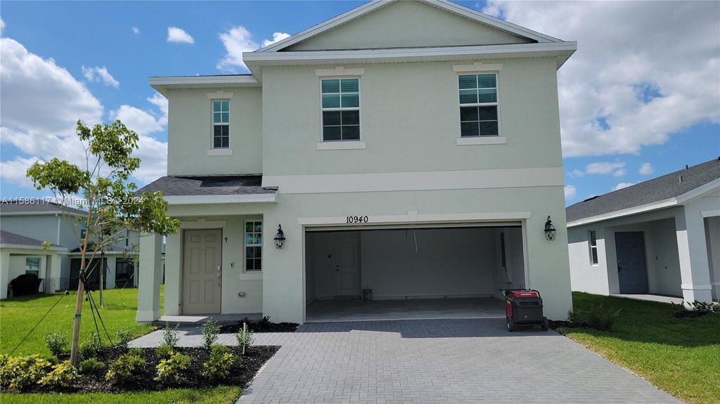 Photo of 10940 NW MIDDLE STREAM Dr, Port Saint Lucie, FL 34987 (MLS # A11586117)