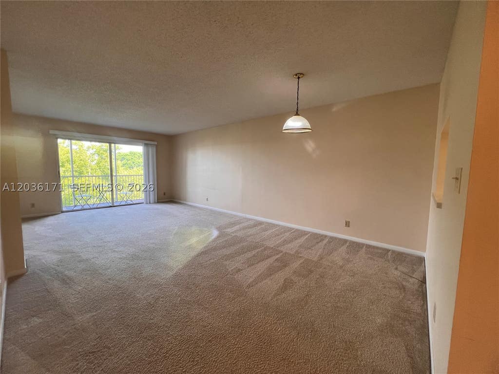 Photo of 1075 Riverside Dr #505, Coral Springs, FL 33071 (MLS # A12036171)