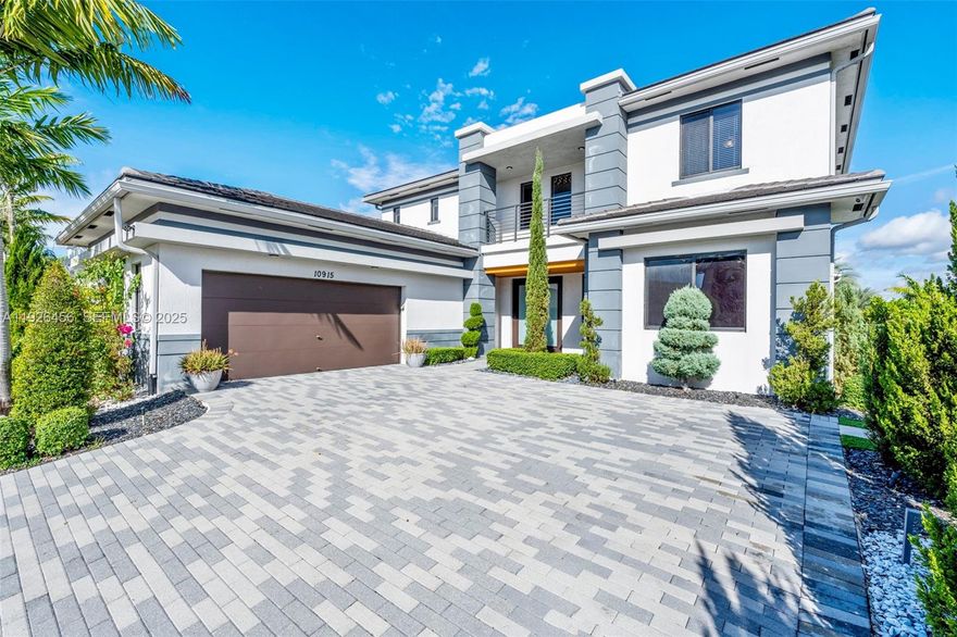 Experience elevated living in this rare Silver Stone model private pool and waterfront, perfectly nestled on one of Cascata’s most exclusive manned gated community. This expansive 5-bed, 5.5-bath residence offers exceptional versatility with a true Next Gen in-law suite, complete with a private entrance, features a kitchenette, living area, 1 bed, 1 bath, and its own separate private laundry stackable washer and dryer—ideal for extended family or guests. Step inside to an open-concept layout highlighted by a chef’s kitchen with premium stainless steel appliances, oversized island, and seamless flow into the main living space. Smart home upgrades features security system and cameras, and electric shades add modern convenience throughout. The ground-floor primary suite features a spa-inspired bathroom with double vanities, separate his and hers custom design built-in walk-in closets, and serene views of the backyard. This home is fully equipped with impact windows, a spacious 2-car garage with extra large driveway, and high-end finishes at every turn. Step outside to your private resort-style oasis—where everyday living feels like a getaway. The Dream Backyard with over three hundred thousand in upgrades showcases, a heated pool, spa, tranquil waterfall feature, and an impressive custom summer kitchen complete with grill, griddle, refrigerator,dual burners, sink, storage, pergola, and remote-controlled screens. This home is an intimate relaxation and unforgettable entertaining.