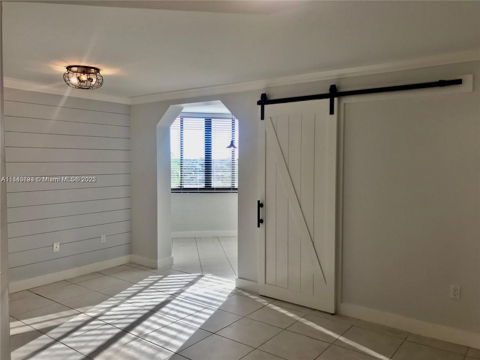 Remodeled unit in West Kendall. This condo is legally a 1 bedroom with a converted 2nd bedroom that could be used as a child's room, den, or office. Top floor condo with a walk-in closet with custom shelves, crown molding, washer/dryer in unit and an adorable modern farmhouse touch. Community offers security, gated entry, guest parking, pool, clubhouse and more. The kitchen was finished with a tile backsplash.