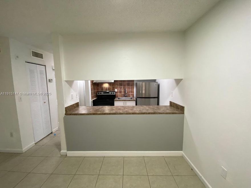 Great Studio, First Floor. This unit features an open layout with ceramic flooring throughout and a full bathroom. Ready to move in immediately. The community offers on-site laundry facilities and is conveniently located near major highways, providing easy access to shopping, dining, and transportation. Ideal for comfortable and practical living.