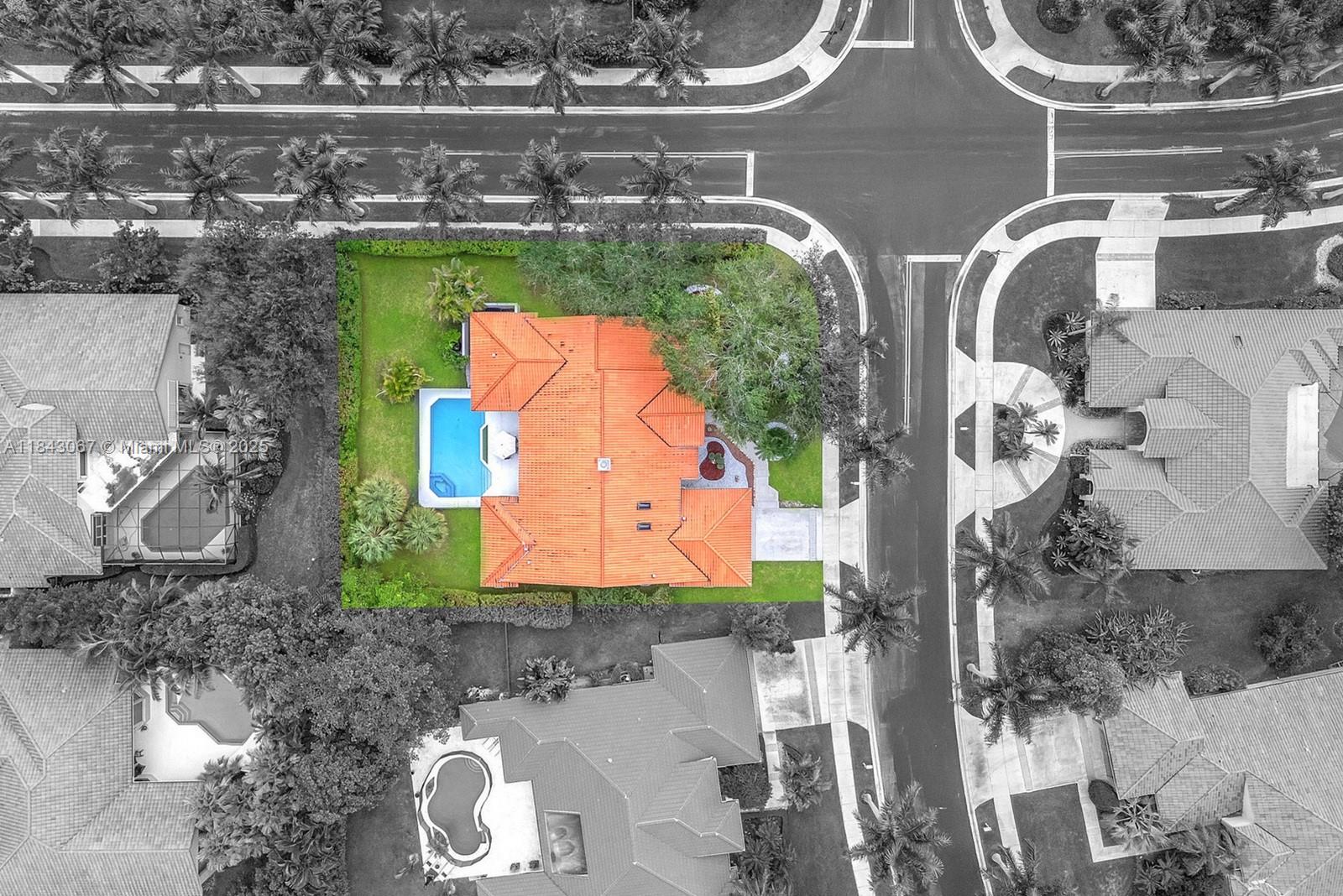 Exquisite 5 bed, 3.5 bath remodeled pool home on premium 15,818 sq ft corner lot in the prestigious gated community of Palm Island, Weston. Enjoy luxury & comfort in elegant, open floor plan w natural light cascading through large windows w custom curtains & electric binds & spectacular 2 sided stone fireplace at the heart of the home. Chef's kitchen features new stainless appliances, large island, custom cabinetry & wet bar w wine fridge. Split floor plan with spacious primary suite w luxurious spa-like en-suite bath & designer closet. Freshly painted inside & out, crown molding, new electrical panels, lighting, new AC units, dreamy laundry room & gorgeous flooring throughout. Outdoor private patio oasis w sparkling, refinished refreshing pool & heated spa w a picturesque backdrop.