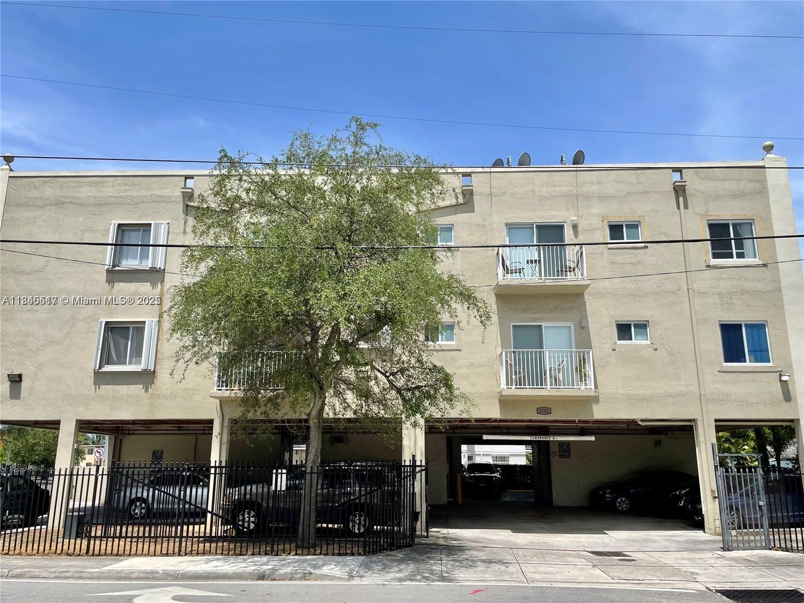 Rare find! 2 Bedroom condo with 2 assigned, covered parking spaces. This affordable unit is centrally located, close to major expressways, making it easy to get anywhere quickly. Corner unit needs updating but is located in a fairly new building (2003). Light, bright condo has a balcony. Unit has storm shutters and a common laundry facility. Although the unit # is 102 the unit is actually located on the second floor because the first floor is the parking garage, making it exempt from the new Florida regulations that affect condo buildings of 3 residential floors. Laundry facility on site. Publix grocery store is 5 blocks. 20% down required to purchase. Publix grocery store is 5 blocks away. Long term tenant in place.