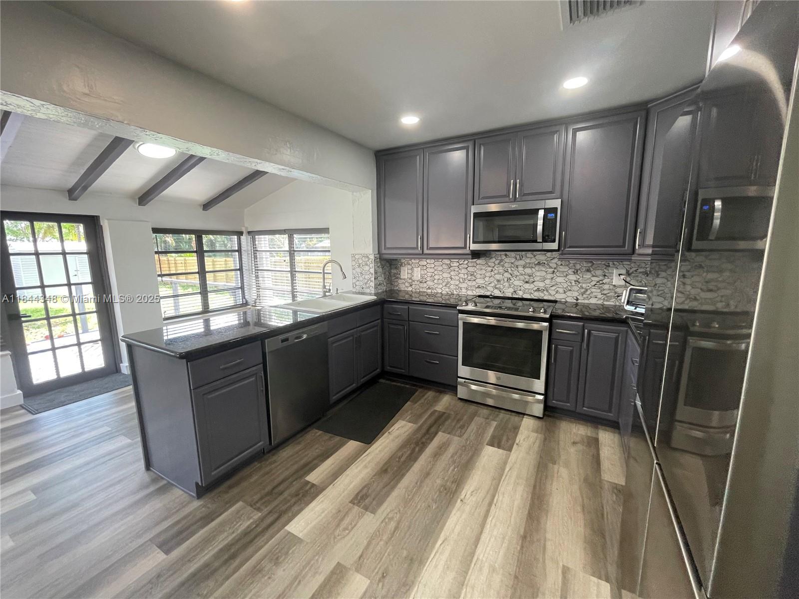 Enjoy Florida living at it's finest with this beautifully renovated 2 bedroom one bathroom house, with upgraded kitchen, bathroom, appliances, flooring and plumbing, new roof and A/C unit. You won't find such a nice house on a such a large lot with a beautiful back yard landscaped well with a large patio deck and private fence. Located 5 minutes from the beach, GulfStream, Casinos, local shopping and restaurants. Partially furnished, landlord is open to fully furnishing if needed. (terms to be discussed)