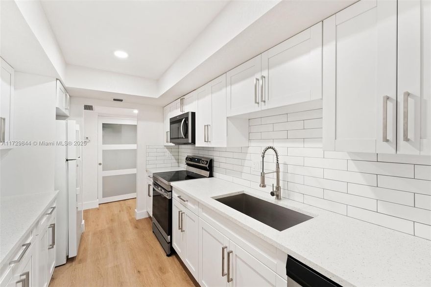 All ages welcome!!!  NOT 55+  This stunning, completely remodeled 2-bedroom, 2-bathroom unit is located on the 6th floor of the Environ. The spacious unit boasts luxury vinyl flooring throughout, a bright and airy ambiance with neutral tones, and abundant natural light. The kitchen has been upgraded with new white shaker cabinets, a new dishwasher, stove, microwave, and air conditioner. Large bedrooms feature walk-in closets, stylish barn doors, and modern ceiling fans. Additional features include a convenient keypad lock and more. Start your day with a cup of coffee while enjoying the breathtaking lake views from your home! Take advantage of the incredible amenities offered  including a library/lounge, bowling alley, tennis, pickleball and basketball courts, billiard room, and card room.