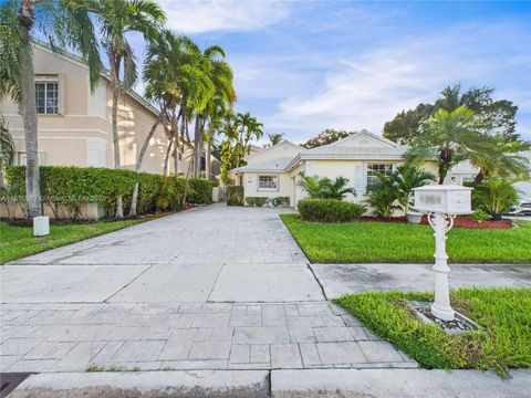 Photo of 1251 E Wilshire Cir E, Pembroke Pines, FL 33027 (MLS # A11850067)