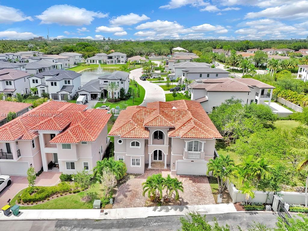 Impeccably upgraded Alamo model in Forest View Estates—a private, gated enclave of just 31 homes beneath mature oaks in sought-after Emerald Hills. This 5-bed + loft (easily convertible to a 6th), 5-bath residence offers over 4,300?sq?ft of luxurious living space. Features include a brand-new 2024 roof, soaring ceilings, full first-floor suite, impact windows/doors, smart wiring, and custom wood & marble flooring. The chef’s kitchen showcases GE Profile appliances, oversized island, and a walk-in pantry, flowing into expansive living and dining areas ideal for entertaining. The grand primary suite offers dual walk-in closets, a spa-style bath, vaulted ceilings, and a serene ambiance. Zoned for A-rated schools, near houses of worship, golf, beaches, dining, and major highways.