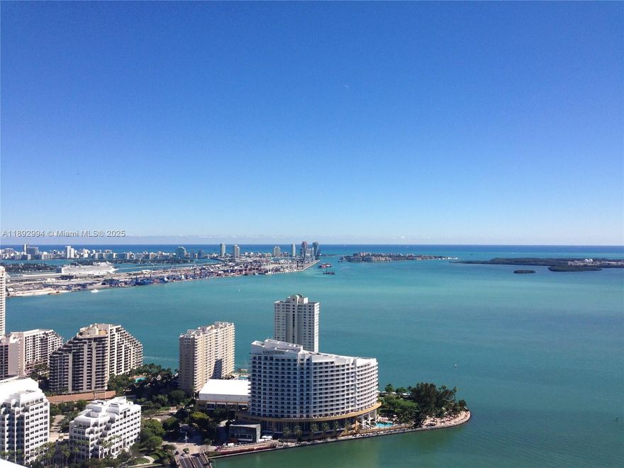 RARE HIGH 50TH FLOOR –MOST DESIRABLE 11 LINE VIEW –LOW MONTHLY HOA –EXCELLENT CONDITION –SOUTH/EAST -FACING CORNER -INVESTORS: TURN KEY CASH FLOW
Building sketch says unit is 1,395 sqft
Custom built extra-high doorways, custom blinds
2 primary bedrooms & 3 bathrooms(2 full,1 half) with 10-foot-high ceilings and billion-dollar views from every room and wraparound balcony.
Thoughtful & spacious floor plan: split bedrooms and en-suite bathrooms both with double sinks and walk-in closets with custom built-in organizers
Separate 3rd half-bathroom for visitors
Rented to exemplary tenant
Luxury building - 2 infinity pools-24/7 security and front desk-valet parking.
Centrally located — 2 to 5-minute walk to Brickell City Centre, Brickell Village Shops, Brickell Key, Whole Foods, and Publix