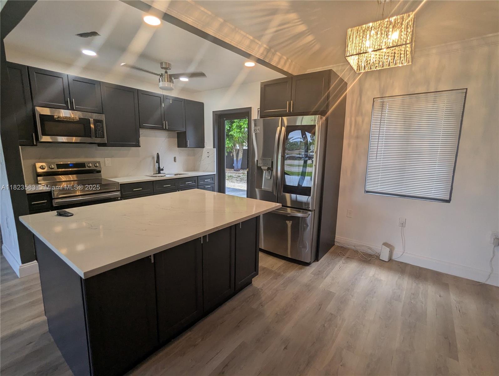 Fully upgraded 2 bedroom 1 bath home. S. S. appliances w/ island countertop bar. This home has upgraded touches throughout. Plenty of natural light coming through oversized windows.Beautiful living in a well sought after neighborhood. People do not leave here! Large back yard in a shared lving space means shared bills and savings.Rent includes shared living costs money. Full upgraded bathroom room for your convenience. Central Ac with a great layout has room for family get togethers. Central located to 95 and 826 expressway with local food, shopping, and public transportation access.There is a space… and then there is a spot that you can call home and enjoy. This will be a shared living space unless you would like to rent out the efficency as well. Come see it to experience it. Call today!
